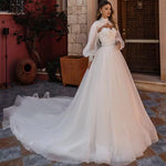 Robe de mariée princesse manche longue bouffante