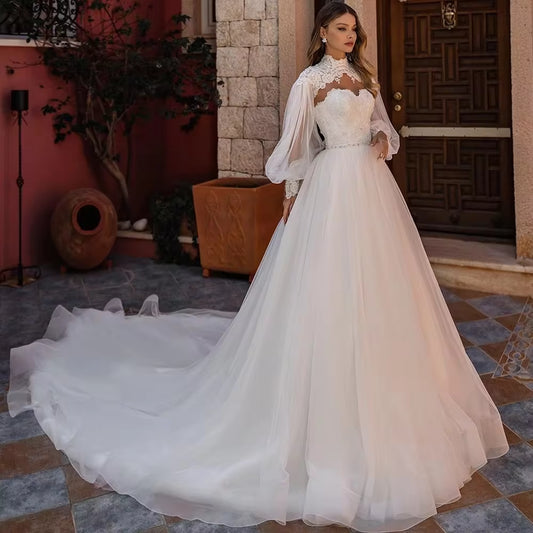 Robe de mariée princesse manche longue bouffante